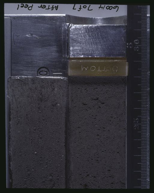 Color photograph of Apollo 16 Core Sample 60014,6000; 7 of 7 Processing photograph displaying Core with peel.