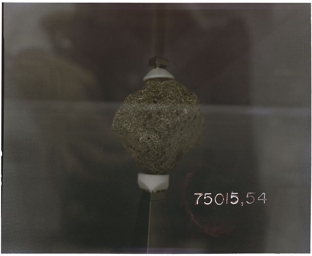 Color Processing photograph of Apollo 17 Sample(s) 75015,54 in a display case.
