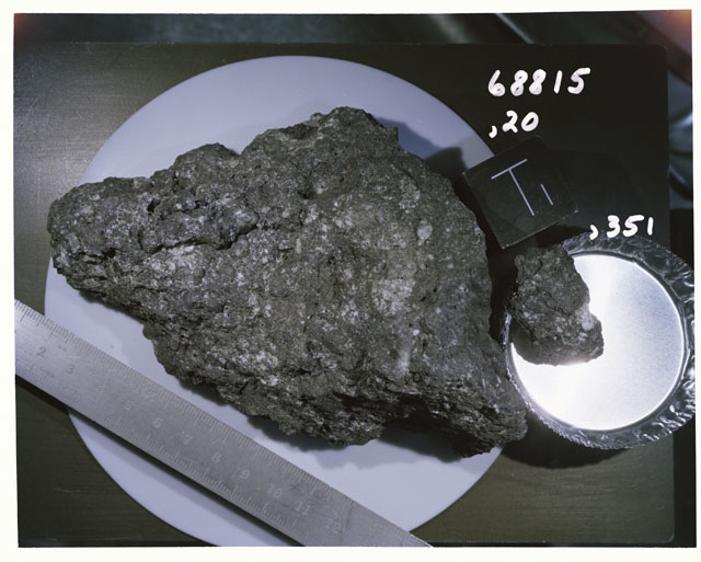 Color photograph of Apollo 16 Sample(s) 68815,20,351; Processing photograph displaying  with an of T.