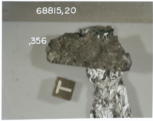 Color photograph of Apollo 16 Sample(s) 68815,20,356; Processing photograph displaying slab with an orientation of T.
