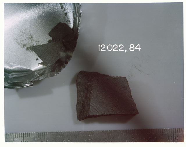 Color photograph of Apollo 12 Sample(S) 12022,84; Processing photograph displaying chips .