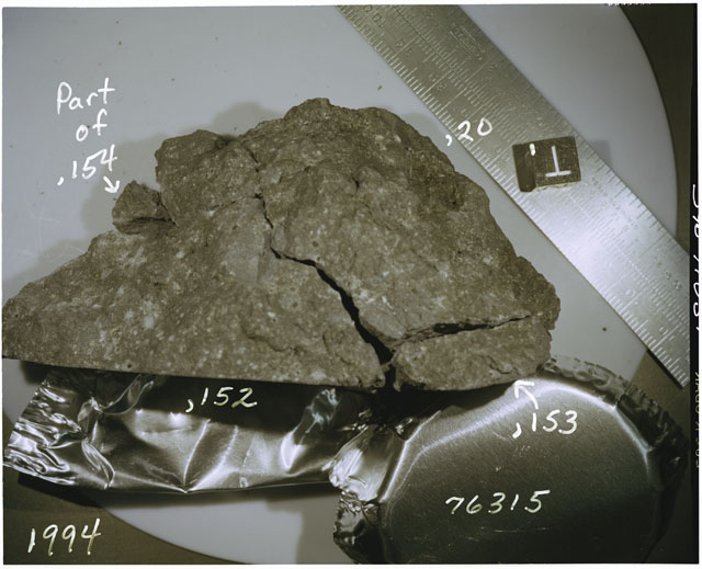 Color photograph of Apollo 17 Sample(s) 76315,20,152-154; Processing photograph displaying reconstruction with an orientation of T.