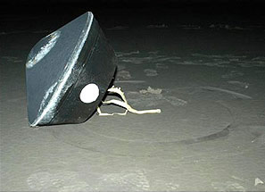 Photo of Stardust sample return capsule after landing.